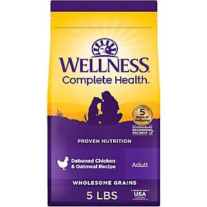 5-pound bag of Wellness Complete Health Wholesome Grains Adult Dry Dog Food in Chicken/Oatmeal Recipe with product branding.