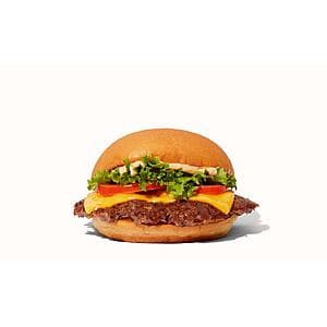 Single Shake Shack ShackBurger in wrapper on white background.