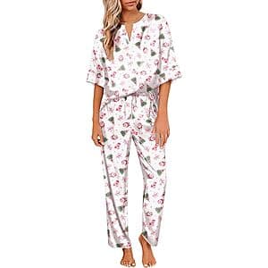 Women's two-piece satin pajama set in silky fabric with V-neck top and matching bottoms, featuring functional pockets.