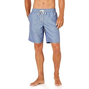 Amazon Essentials men's 9-inch swim trunks in four color options: blue geometric print, charcoal graphic marks, silhouette floral, and coral orange.