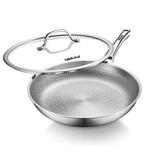 Tri-ply titanium frying pan with ergonomic handle displayed against a neutral background.