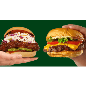 Single ShackBurger with sesame seed bun and toppings on a white wrapper or plate.