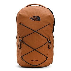 The North Face Jester Everyday Laptop Backpack in Leather Brown and Black colorway, showing front-facing view with multiple compartments and padded shoulder straps.