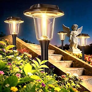 Eight black solar pathway lights with waterproof housing, designed for garden and outdoor placement.