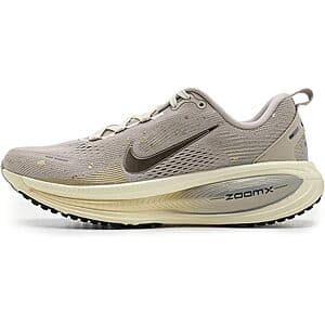 Nike Women's Vomero 18 running sneaker in cream li, metallic gold grain, and coconut milk colorway with maximum cushioning design.