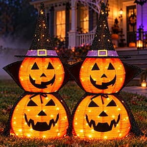 Two 3-foot tall Halloween pumpkin outdoor decorations with warm white LED lights on a lawn or garden setting.