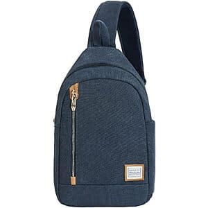 Indigo Travelon sling bag with padded compartment for tablets and integrated anti-theft security features.