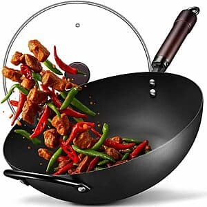 Qingchui 13-inch FGJ pre-seasoned carbon steel wok with matching glass lid, featuring dark seasoned steel finish and domed glass cover.