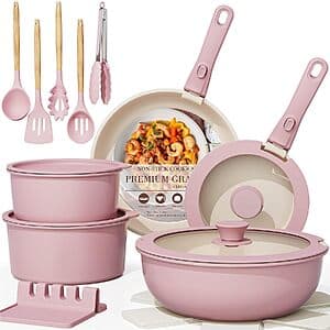 Astercook 21-piece ceramic nonstick cookware set in pink with removable handles, including pans, pots, and cooking utensils.