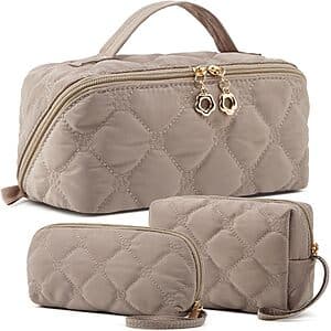 Pink embroidery puffer 3-piece makeup cosmetic travel bag set with multiple compartments for organizing beauty products.