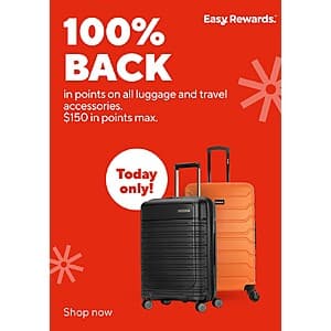 Various luggage and travel accessories in different colors and sizes displayed at Staples.