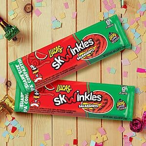 Six individually wrapped Lucas Salsagheti watermelon candy strips with tamarind sauce flavoring in red and yellow packaging.