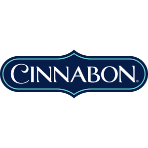 Cinnabon Classic Roll featuring a spiral of cinnamon filling with white cream cheese frosting.