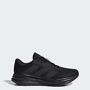 Black adidas Galaxy 7 men's running shoe displayed from the side view, showing the shoe's profile design and branding.