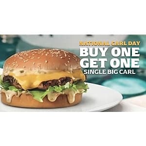 Carl's Jr. Big Carl burger with charbroiled beef patties, melted cheese, lettuce, and sauce on a seeded bun.