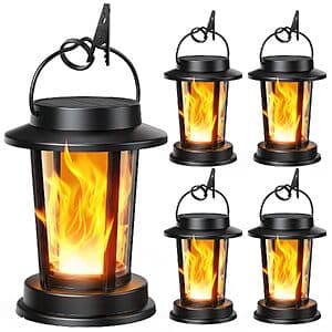 Four TuyLuxe solar-powered outdoor hanging lanterns with flickering flame effect, showing warm amber-colored light in dark finish.