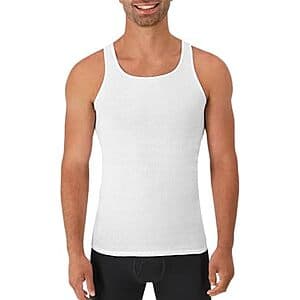Six white Hanes cotton ribbed tank undershirts for men with moisture-wicking fabric.