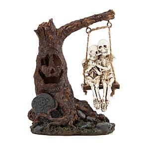 Halloween skull statue featuring skeleton-couple with dead-tree and swing design, includes spooky LED light effect, compact decorative piece measuring 3.9 inches long and 5.5 inches tall.