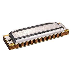 HOHNER 532BX-C Blues Harp Harmonica with silver-tone reeds and black plastic comb, positioned to show the harmonica's holes and key identifier.